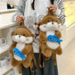 Otter Holding Fish Backpack